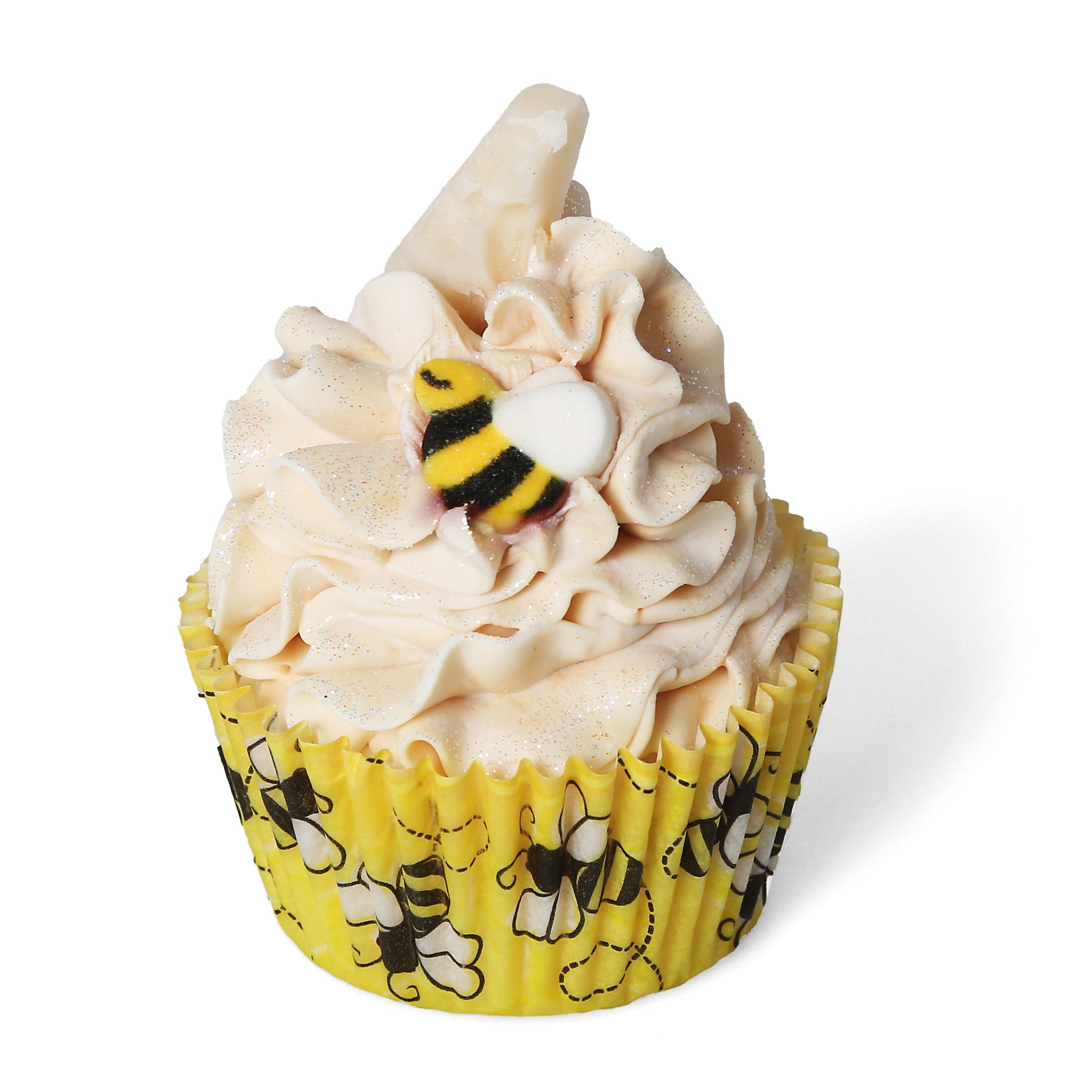 Bubble bee themed soap cupcake with yellow liner with bee pattern. Cream colored soap frosting topped with gold glitter and small bee shaped decoration.