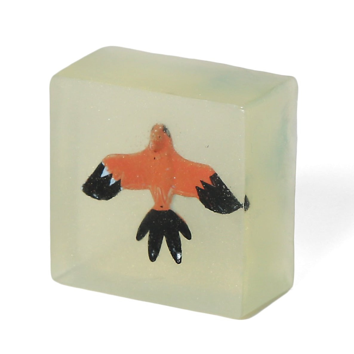 Clear light yellow square soap with a bird inside