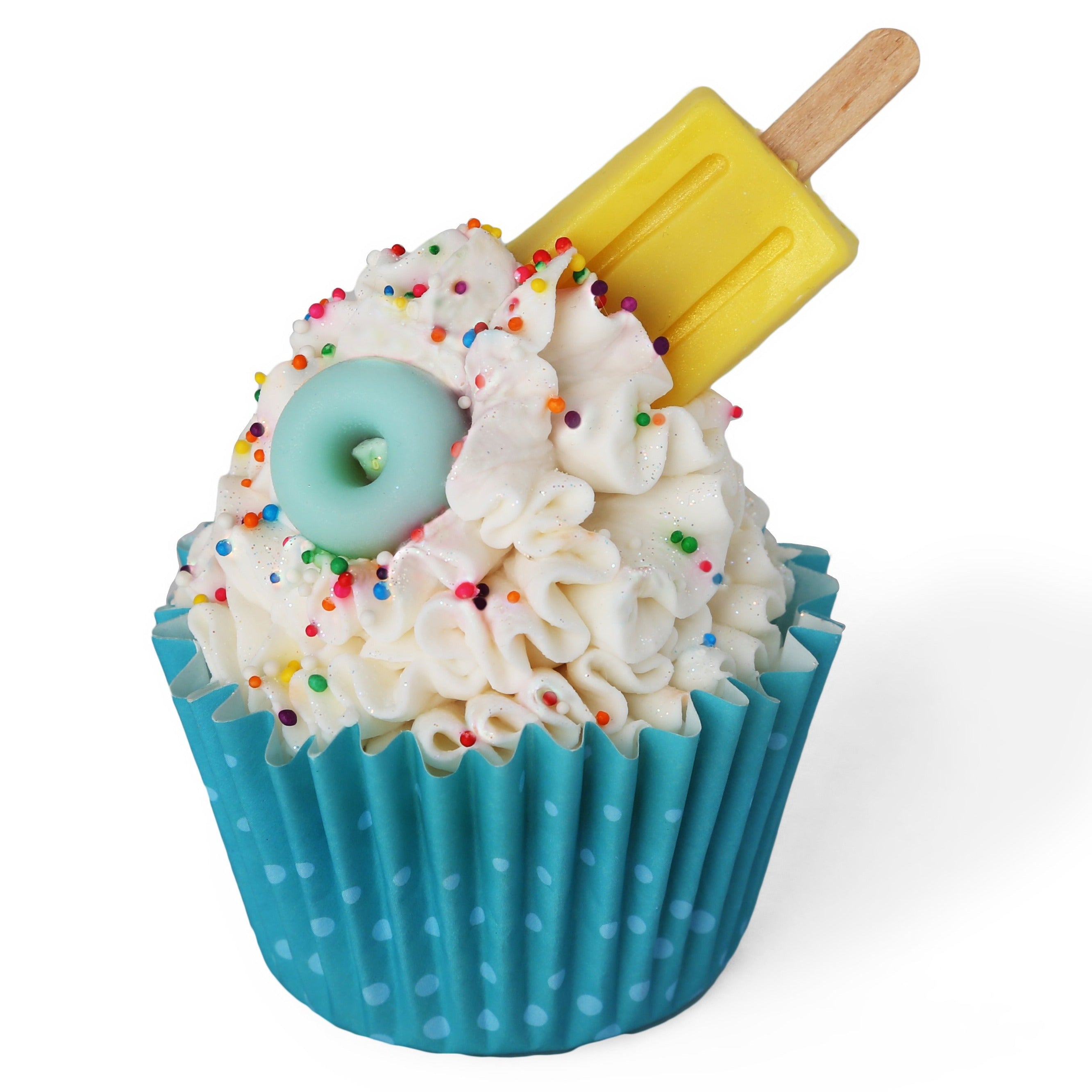 Pool party themed soap cupcake. Blue liner with dots. White soap frosting with colorful sprinkles, topped with a light blue floatie and a small yellow popsicle