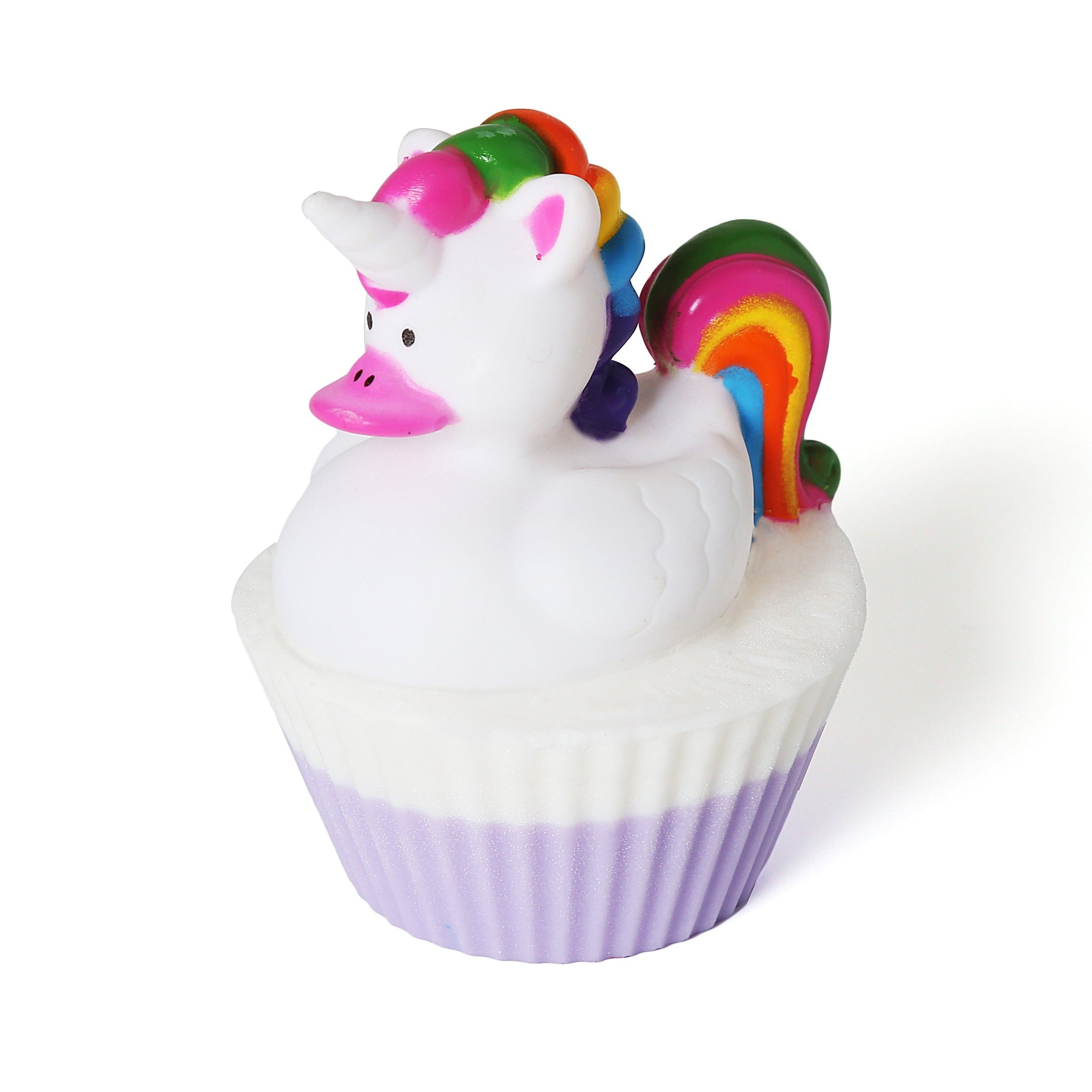 Round shaped soap with a light purple and white liner. Topped with a unicorn toy duck. Duck has a pink beak, white unicorn horn, and rainbow hair.