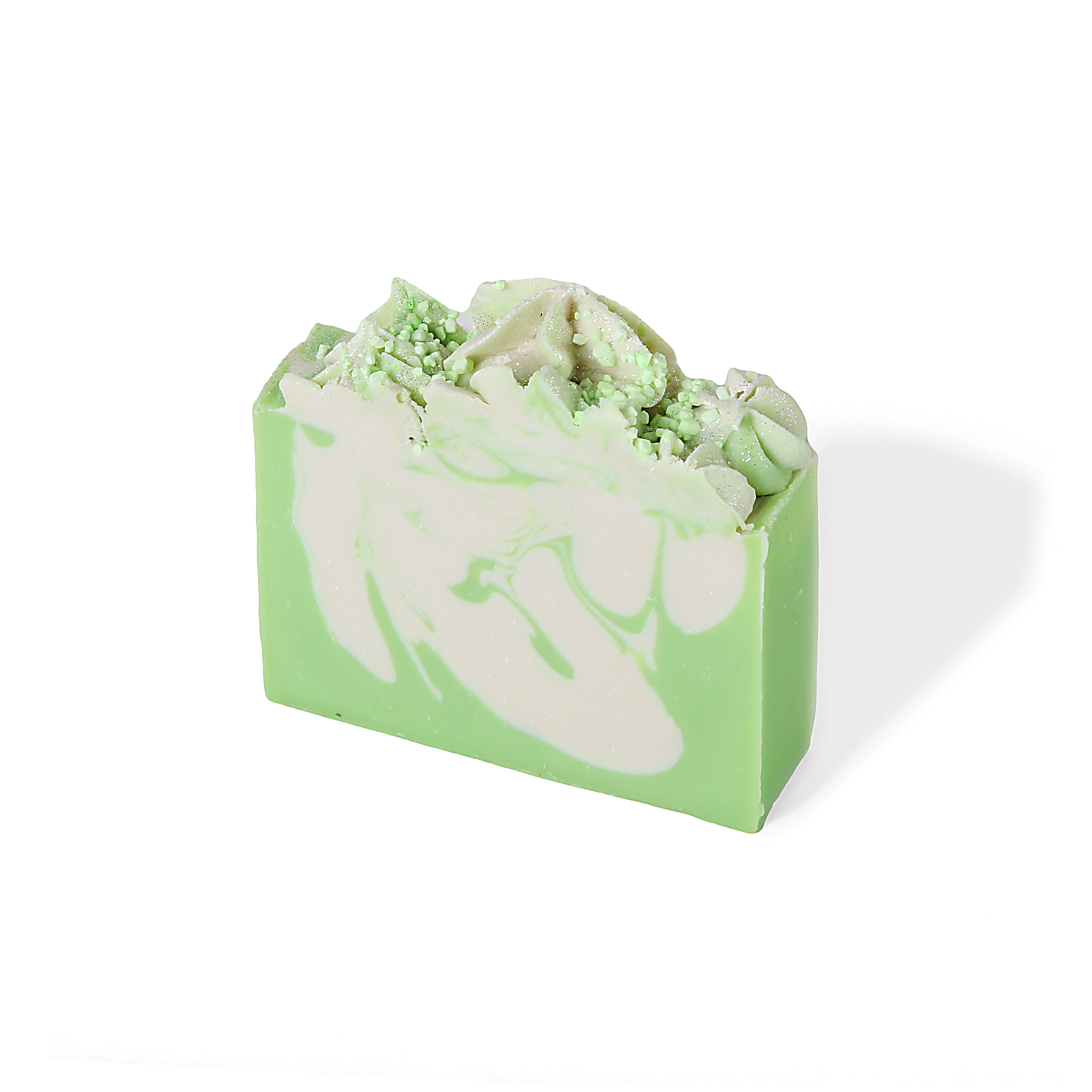 A mint green and white swirled bar soap with a fluffy frosting top.