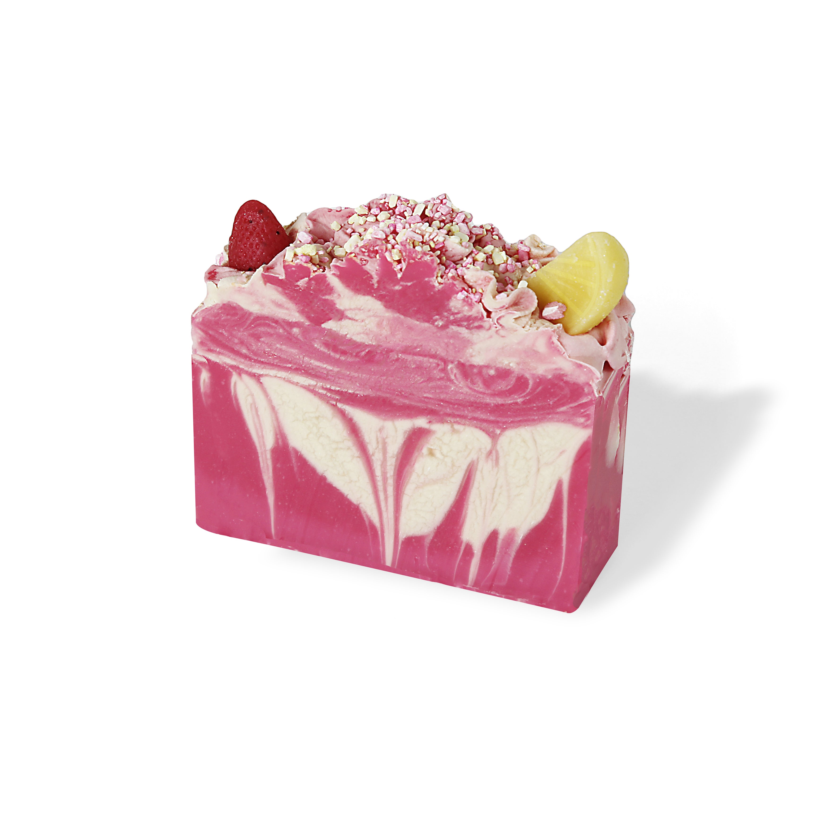 a pink and white swirl bar soap with a fluffy frosting top. Featuring a soap shaped lemon slice and soap strawberry.